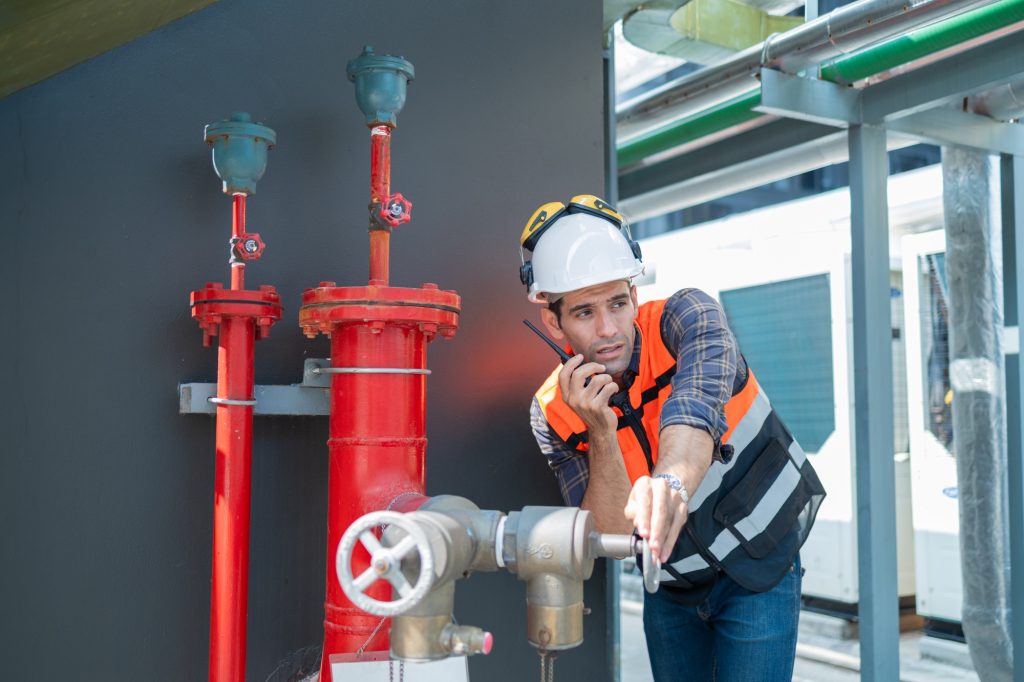 Engineer under checking the industry Fire Protection system